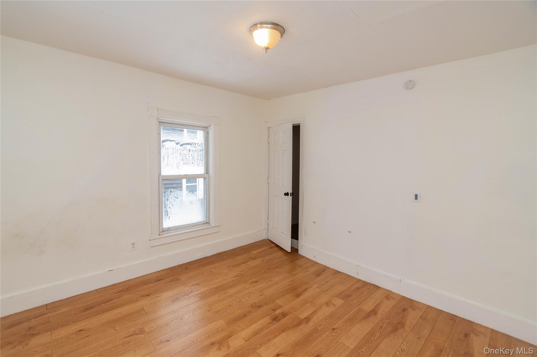 41 Edgar Street Liberty, NY 12754 - Photo 34 of 42 Empty room featuring hardwood / wood-style flooring and baseboards