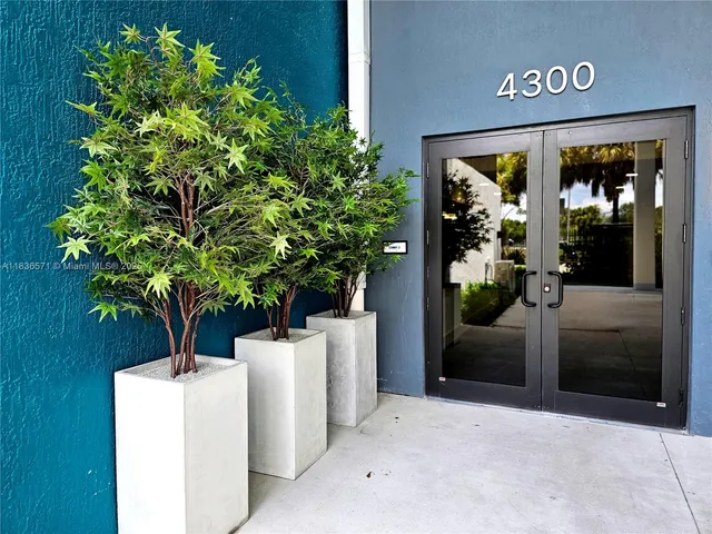a potted plant sitting in front of a building