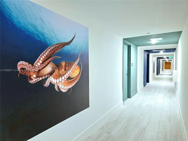 a view of a swimming pool with a garden and trees