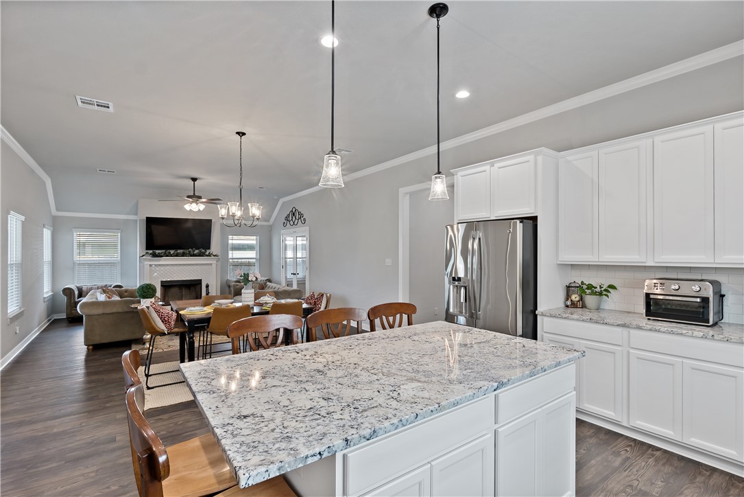 3161 Normandy Way Bryan, TX 77808 - Photo 12 of 27 a view of kitchen center island and living room view