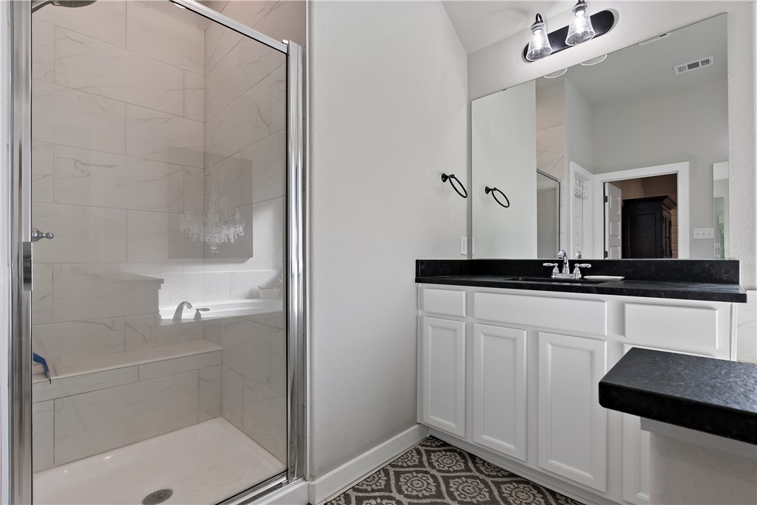 3161 Normandy Way Bryan, TX 77808 - Photo 18 of 27 a bathroom with a shower and a sink