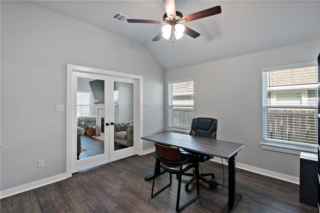3161 Normandy Way Bryan, TX 77808 - Photo 22 of 27 a view of a workspace with furniture and a window