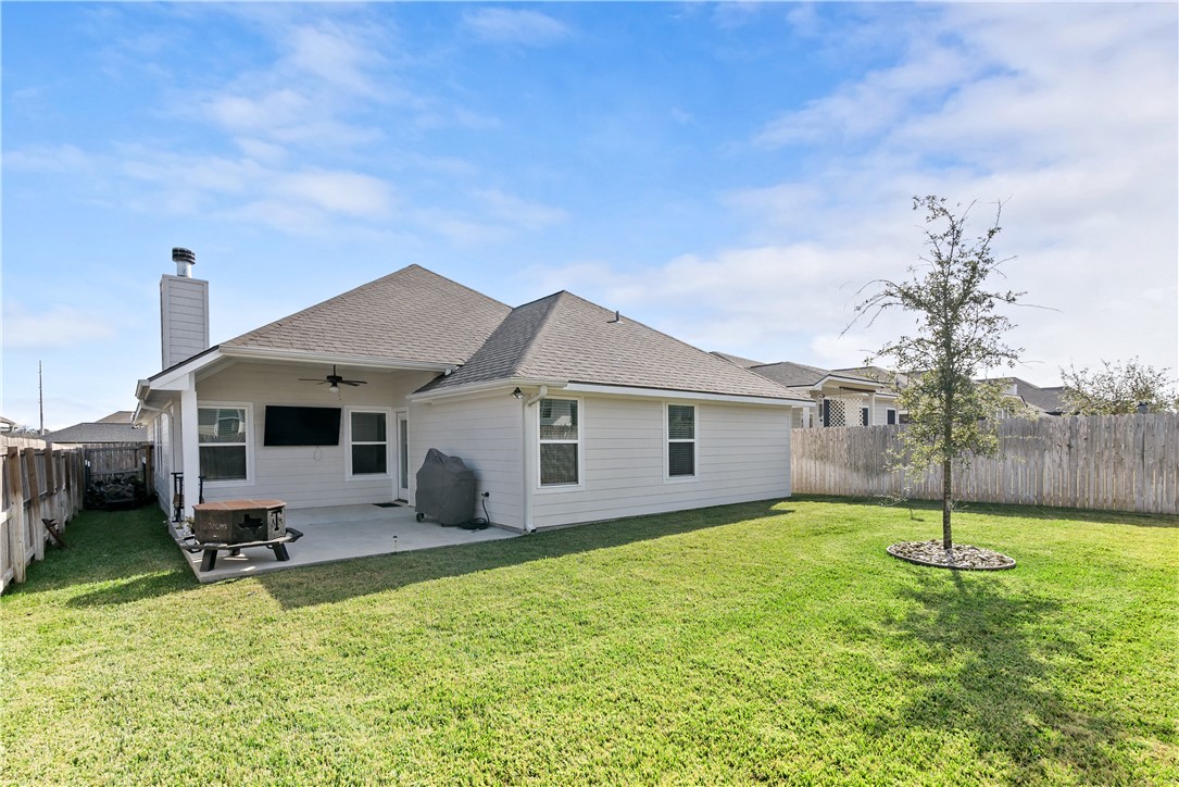 3161 Normandy Way Bryan, TX 77808 - Photo 26 of 27 a backyard of a house with table and chairs