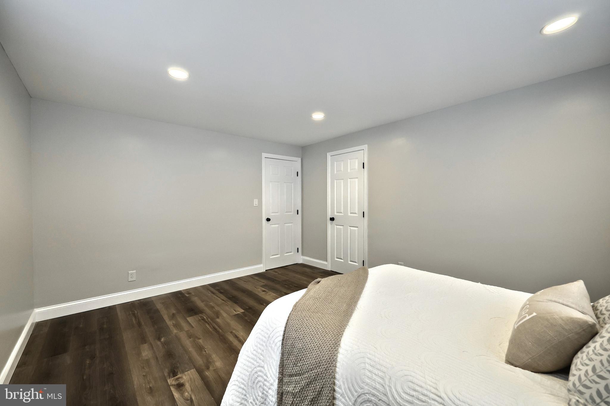 6414 Liberty Road Baltimore, MD 21207 - Photo 17 of 54 a bedroom with a bed and a black white wall