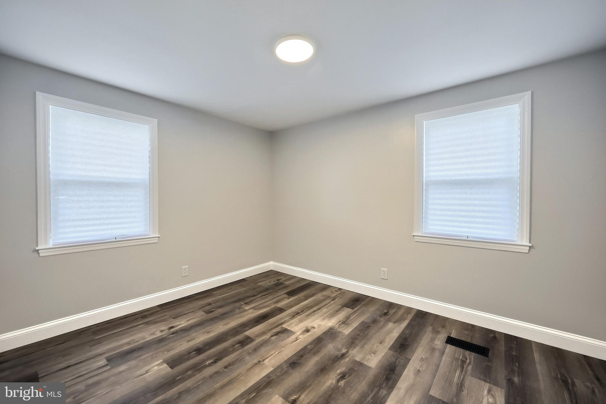 6414 Liberty Road Baltimore, MD 21207 - Photo 18 of 54 a view of a room with wooden floor and fan