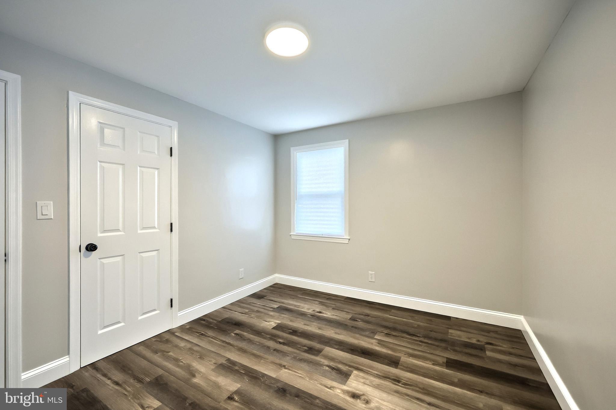 6414 Liberty Road Baltimore, MD 21207 - Photo 19 of 54 wooden floor in an empty room