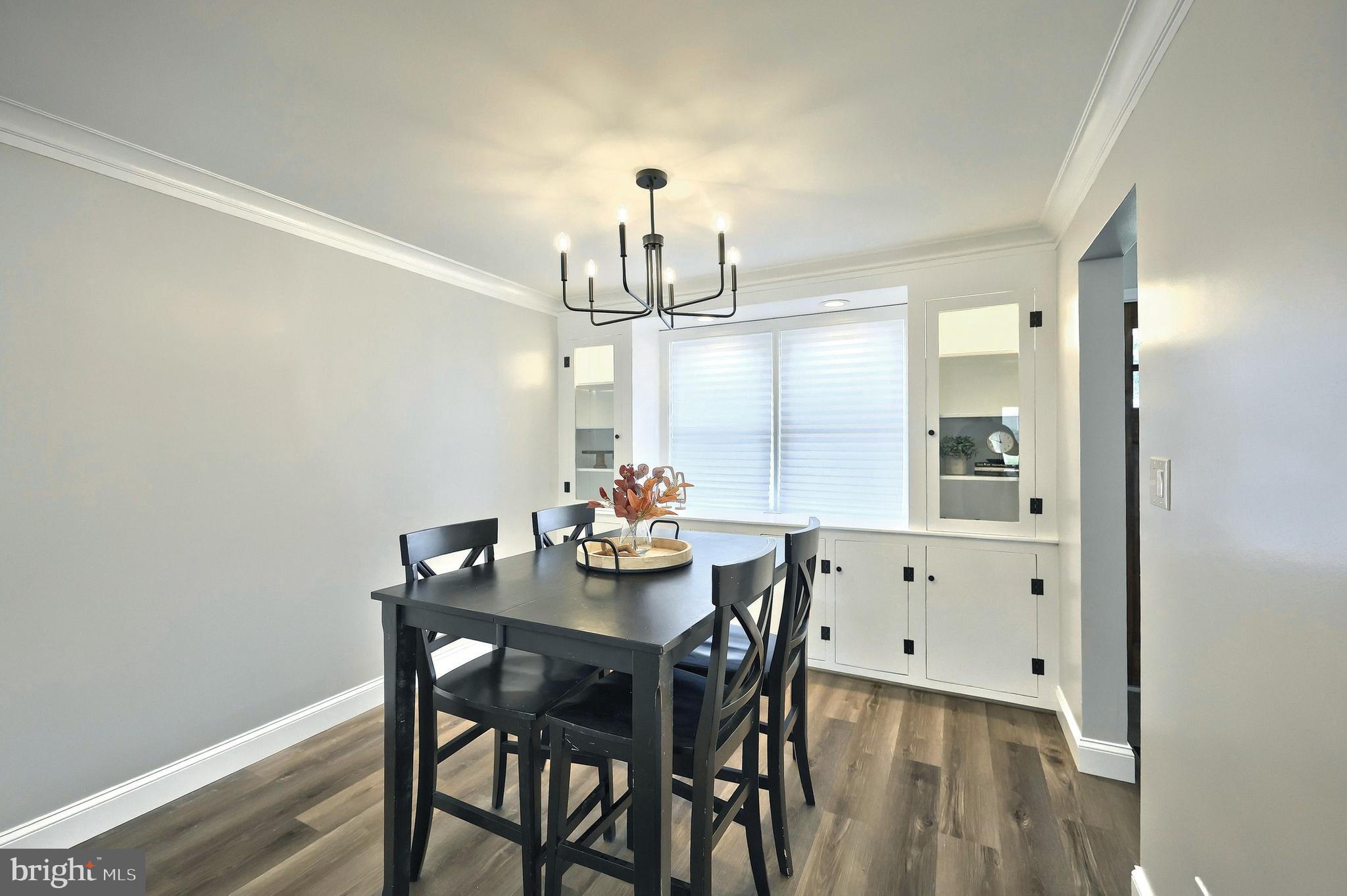 6414 Liberty Road Baltimore, MD 21207 - Photo 20 of 54 a view of a dining room with furniture and wooden floor