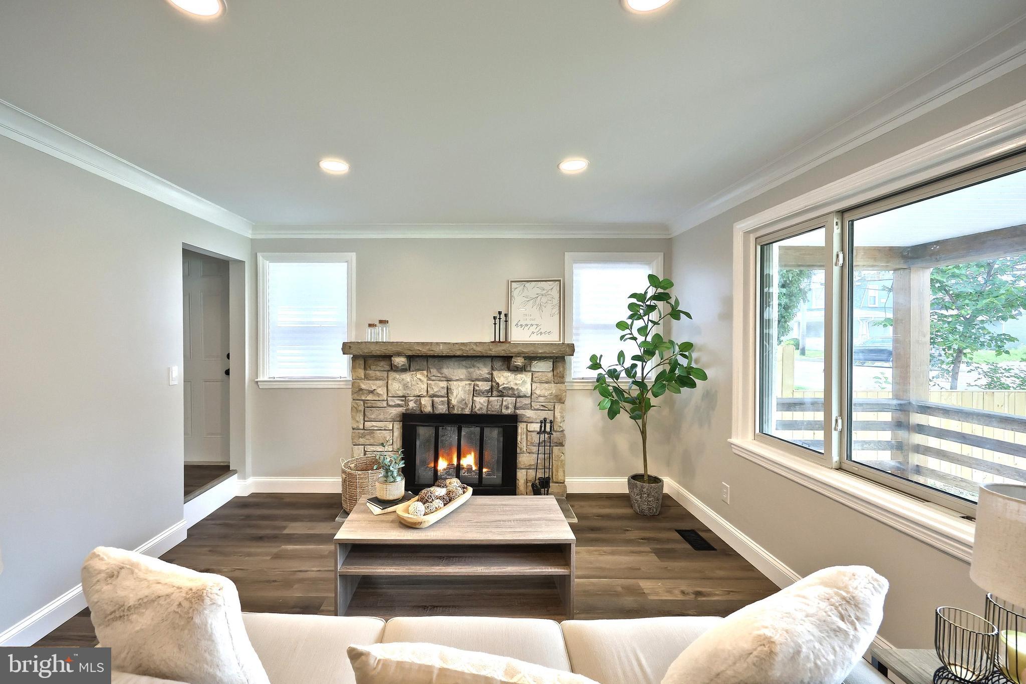 6414 Liberty Road Baltimore, MD 21207 - Photo 21 of 54 a living room with furniture and a fireplace