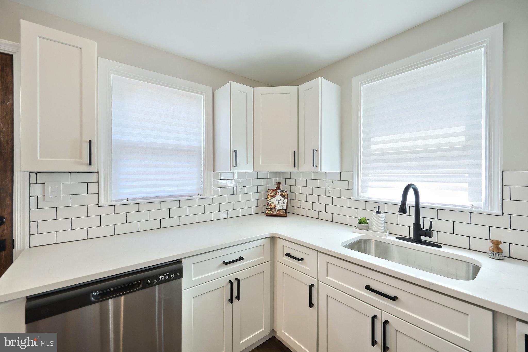 6414 Liberty Road Baltimore, MD 21207 - Photo 27 of 54 a kitchen with a sink cabinets and window