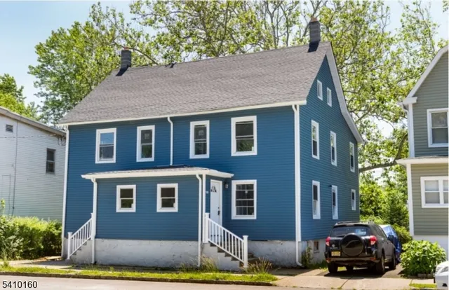 a car parked in front of a house