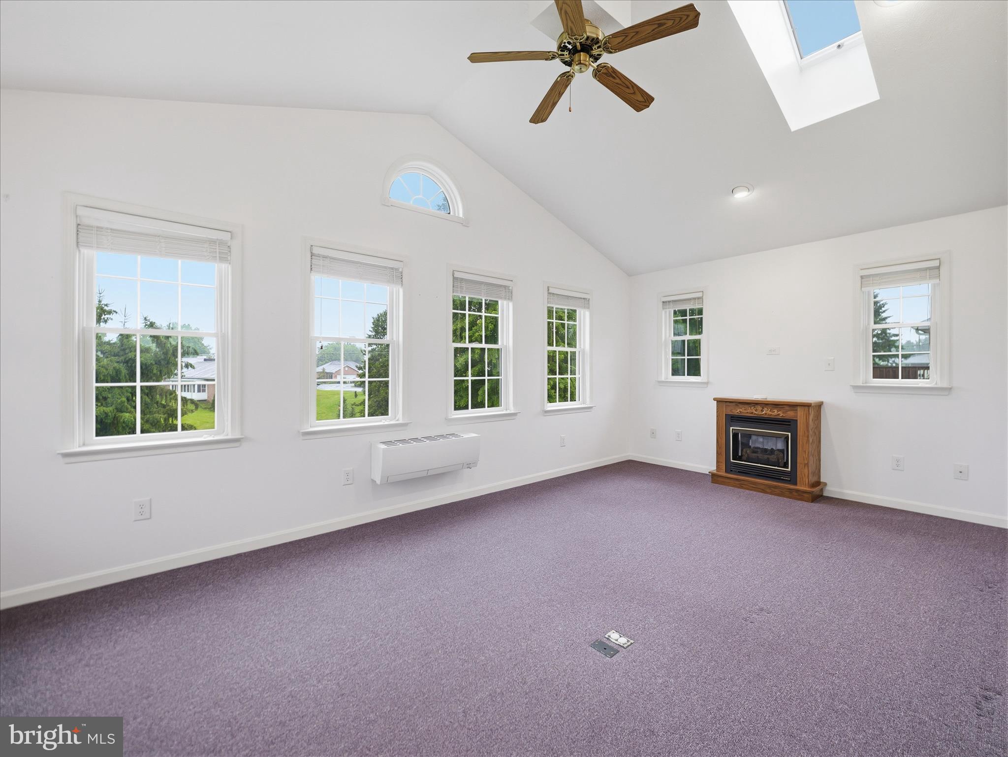 12274 Country Club Road Waynesboro, PA 17268 - Photo 14 of 41 Sunroom with lots of windows and gas fireplace