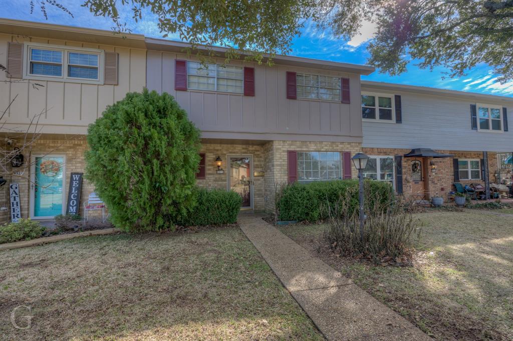 a view of a house with a garden