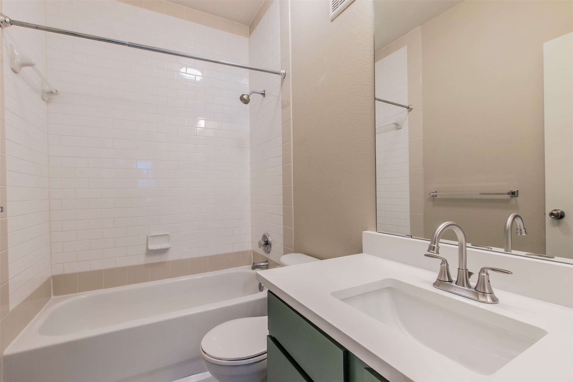 1201 Grove Boulevard, Unit 702 Austin, TX 78741 - Photo 15 of 19 a bathroom with a sink toilet and shower