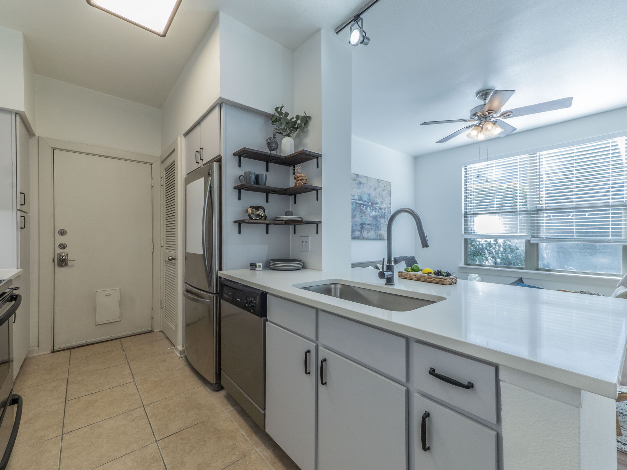1201 Grove Boulevard, Unit 702 Austin, TX 78741 - Photo 4 of 19 a kitchen with a sink and cabinets