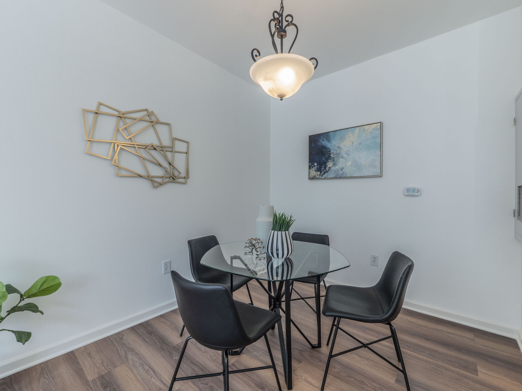 1201 Grove Boulevard, Unit 702 Austin, TX 78741 - Photo 7 of 19 a view of a dining room with furniture and wooden floor