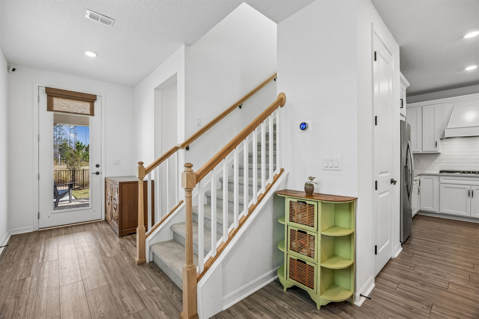 236 Hawthorn Park Circle Yulee, FL 32097 - Photo 5 of 28 a view of entryway and hall with wooden floor