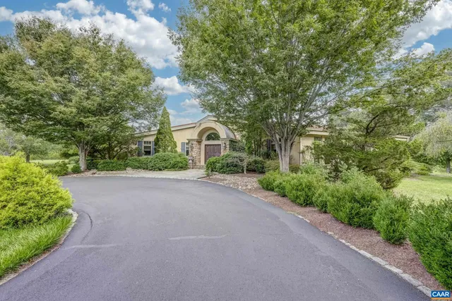 an aerial view of lake residential houses with outdoor space and seating