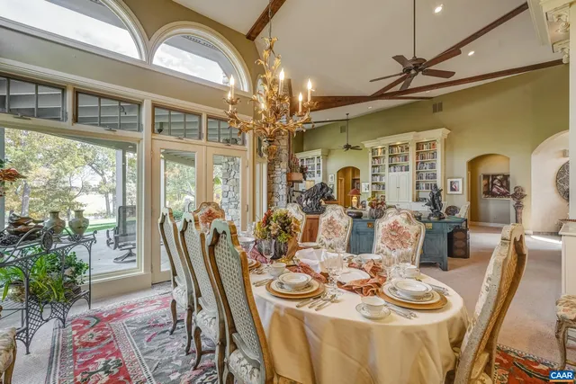 a open kitchen with granite countertop a stove top oven a sink a counter space and cabinets