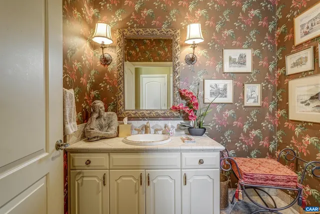a living room with furniture and a book shelf