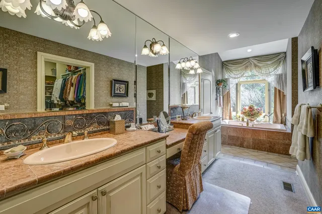 a living room with furniture and a view of kitchen