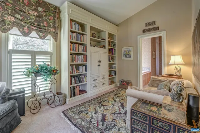 a kitchen with stainless steel appliances kitchen island granite countertop a refrigerator and a sink