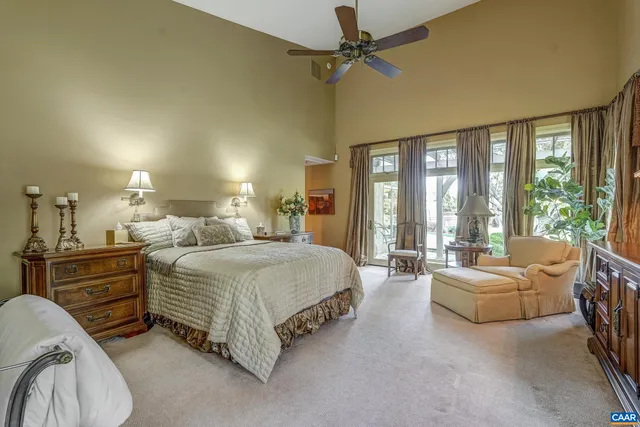 a bedroom with a bed and a couch