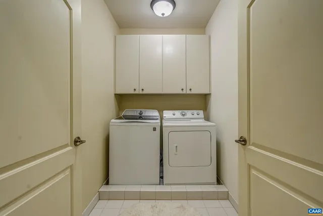 a bedroom with a bed chair and a window