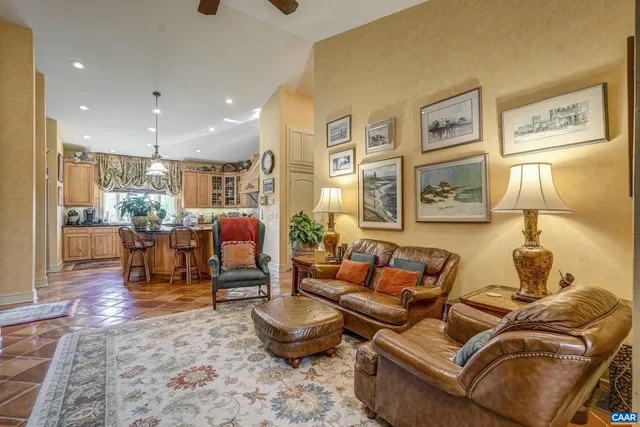 a view of a house with swimming pool and sitting area
