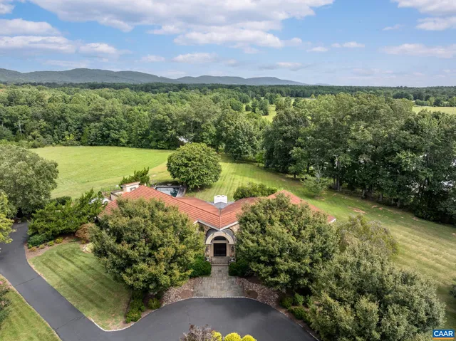 a view of a lake with a yard