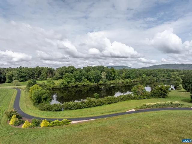 a view of a lake with a yard