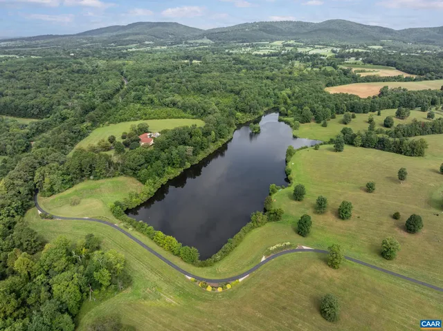a view of a lake with a yard