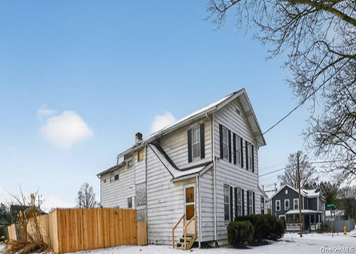 62 George Street Owego, NY 13827 - Photo 3 of 21 Snow covered property featuring a chimney