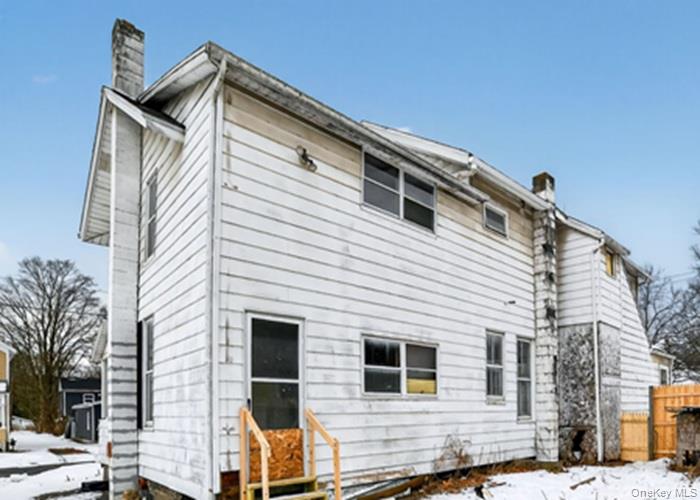 62 George Street Owego, NY 13827 - Photo 5 of 21 Snow covered property with a chimney
