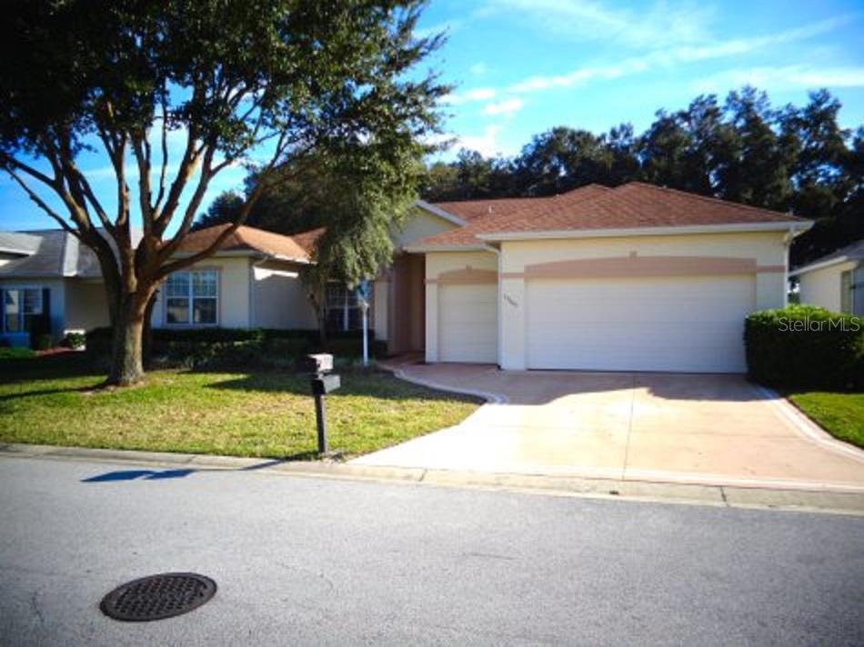 17187 Southeast 116th Court Road Summerfield, FL 34491 - Photo 1 of 1 a house with trees in the background