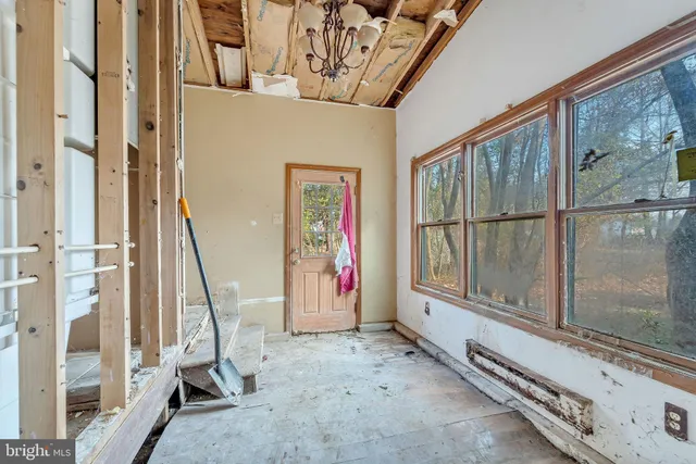 a view of a room with wooden walls