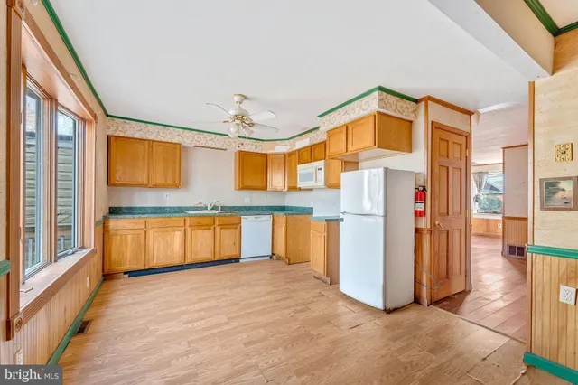 a view of a large kitchen with a large window