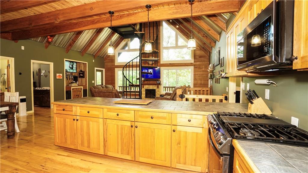 169 Williams Road Taylorsville, GA 30178 - Photo 18 of 84 a kitchen with stainless steel appliances granite countertop a stove and a microwave