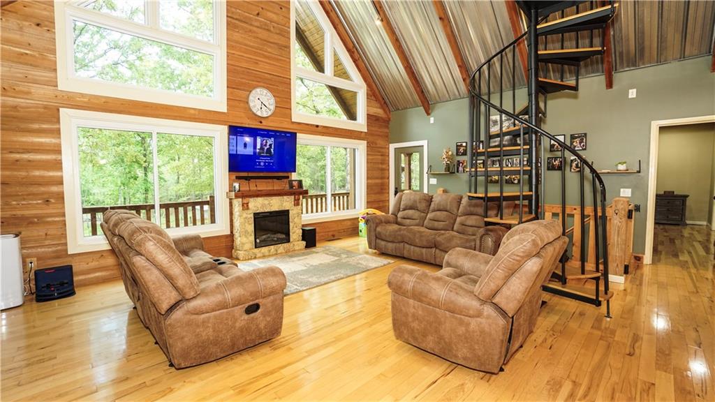 169 Williams Road Taylorsville, GA 30178 - Photo 21 of 84 a living room with fireplace furniture and a large window