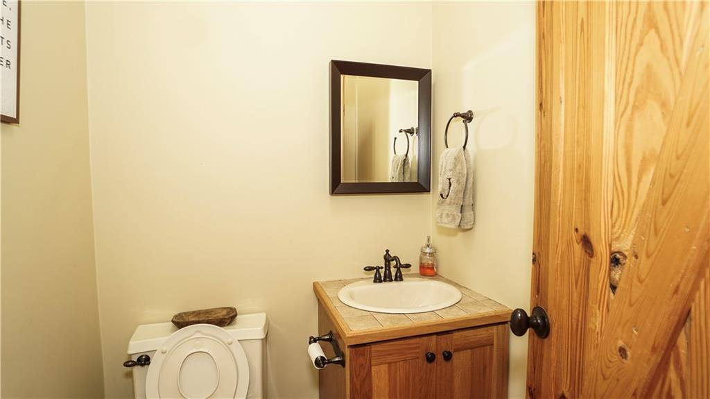 169 Williams Road Taylorsville, GA 30178 - Photo 24 of 84 a bathroom with a sink and a mirror