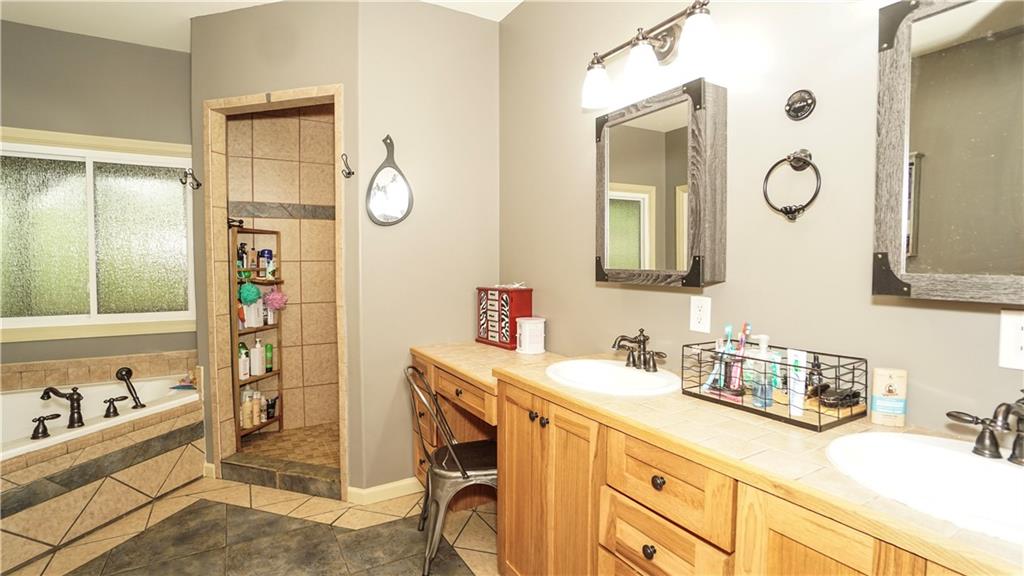 169 Williams Road Taylorsville, GA 30178 - Photo 30 of 84 a bathroom with a sink and a mirror