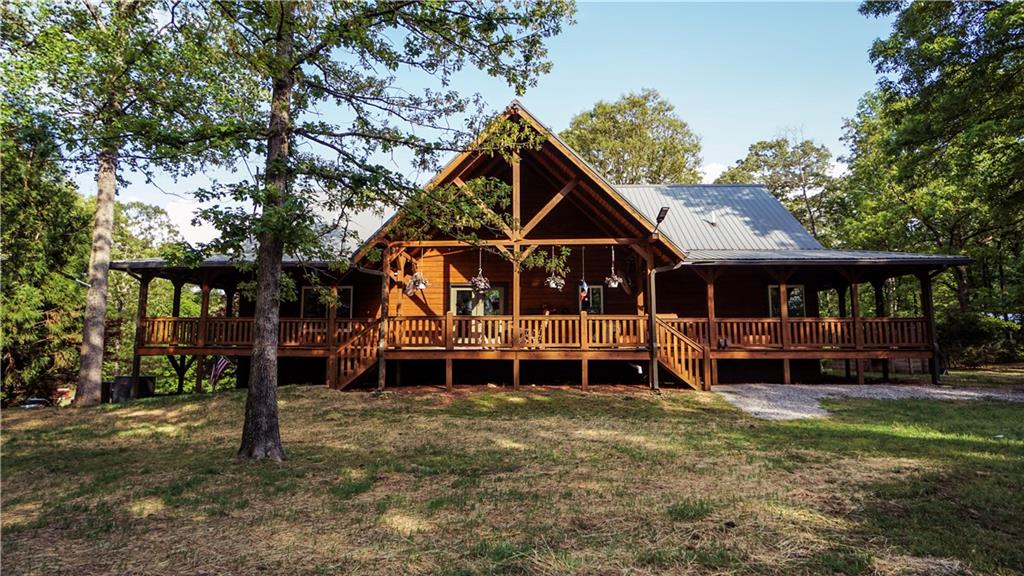 169 Williams Road Taylorsville, GA 30178 - Photo 38 of 84 a front view of a house with a yard table and chairs