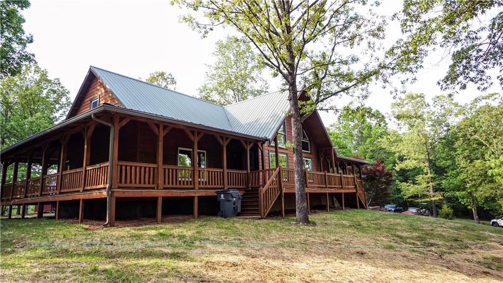 169 Williams Road Taylorsville, GA 30178 - Photo 39 of 84 a view of a house with a yard and balcony
