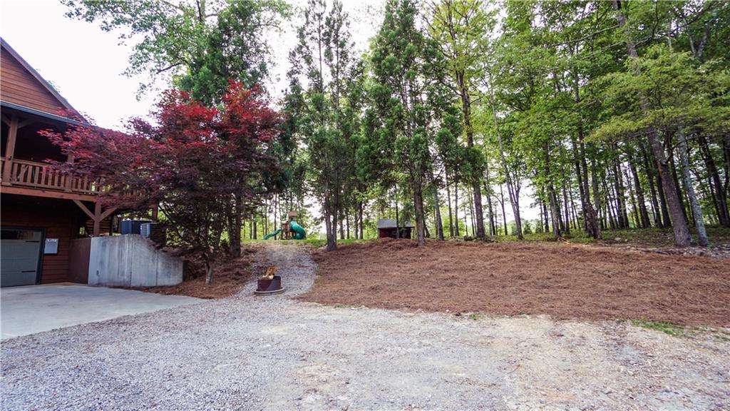 169 Williams Road Taylorsville, GA 30178 - Photo 46 of 84 a backyard of a house with lots of green space