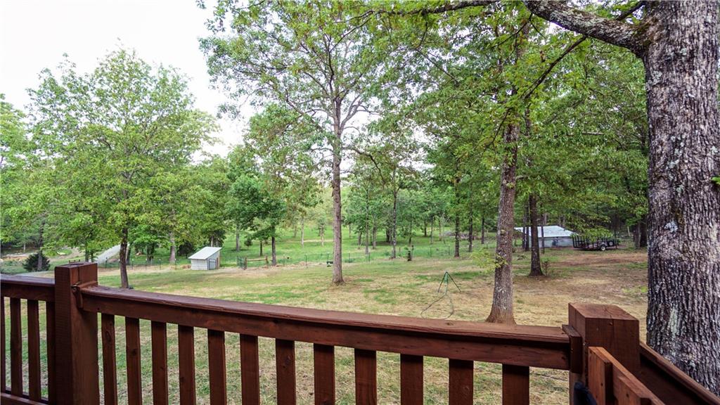 169 Williams Road Taylorsville, GA 30178 - Photo 48 of 84 a view of a yard with large trees and a wooden fence