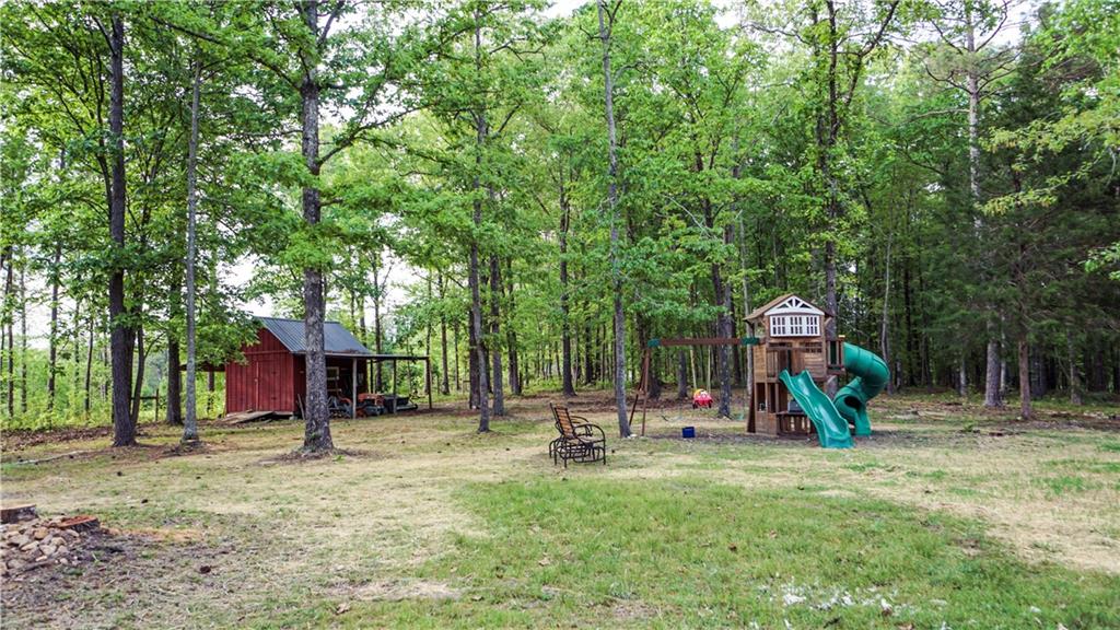 169 Williams Road Taylorsville, GA 30178 - Photo 56 of 84 a view of outdoor space with garden and trees
