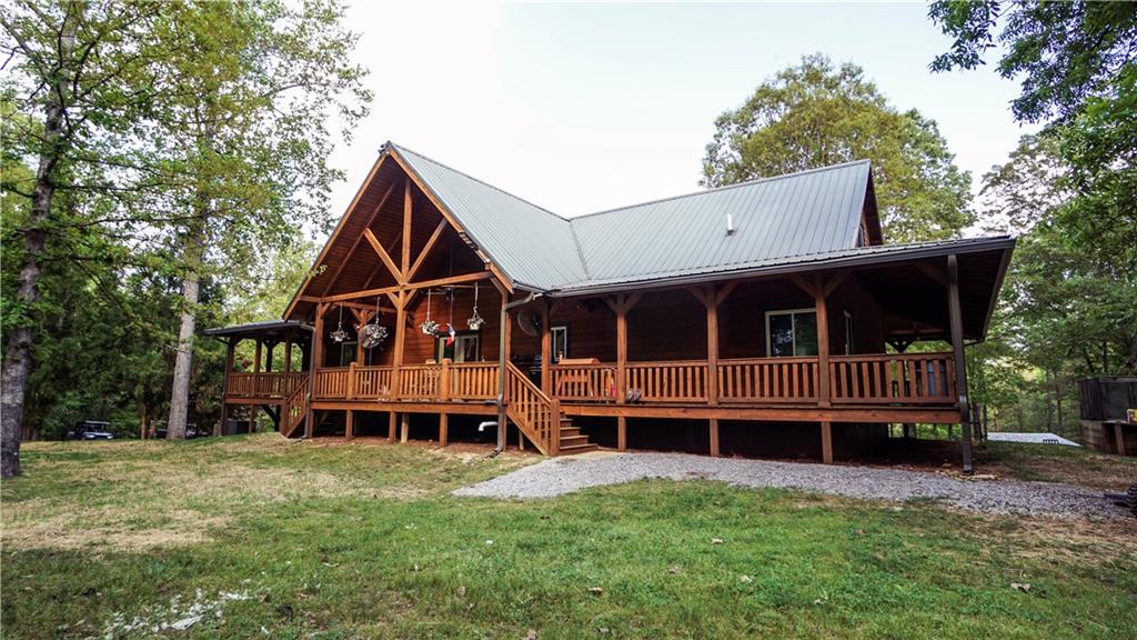 169 Williams Road Taylorsville, GA 30178 - Photo 8 of 84 a view of house with a big yard and large trees