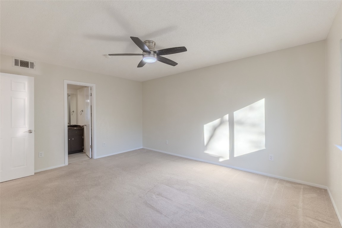 8203 Beaver Brook Lane Austin, TX 78748 - Photo 13 of 34 an empty room with a empty space and windows