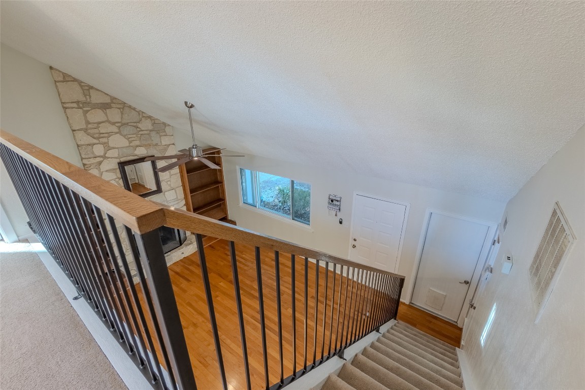 8203 Beaver Brook Lane Austin, TX 78748 - Photo 17 of 34 a view of staircase with railing and white walls