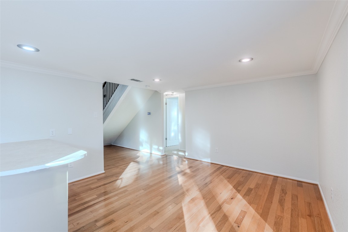 8203 Beaver Brook Lane Austin, TX 78748 - Photo 8 of 34 a view of an empty room with wooden floor and a window