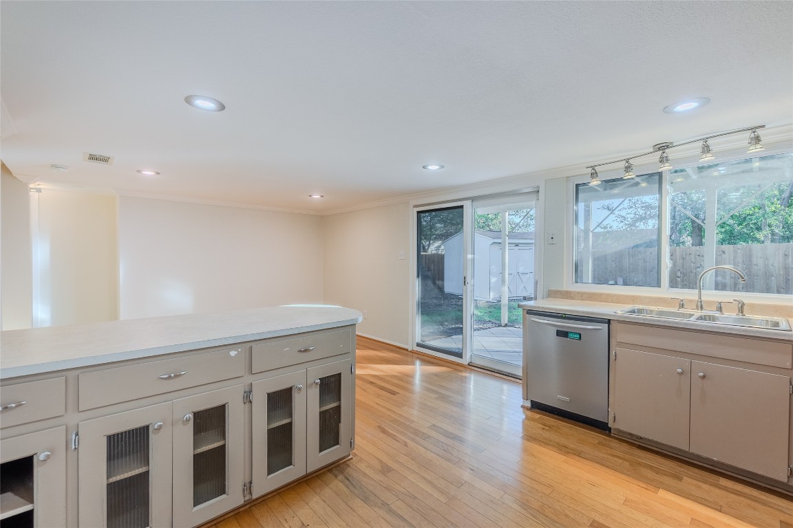 8203 Beaver Brook Lane Austin, TX 78748 - Photo 9 of 34 a large kitchen with a lot of counter space and wooden floor